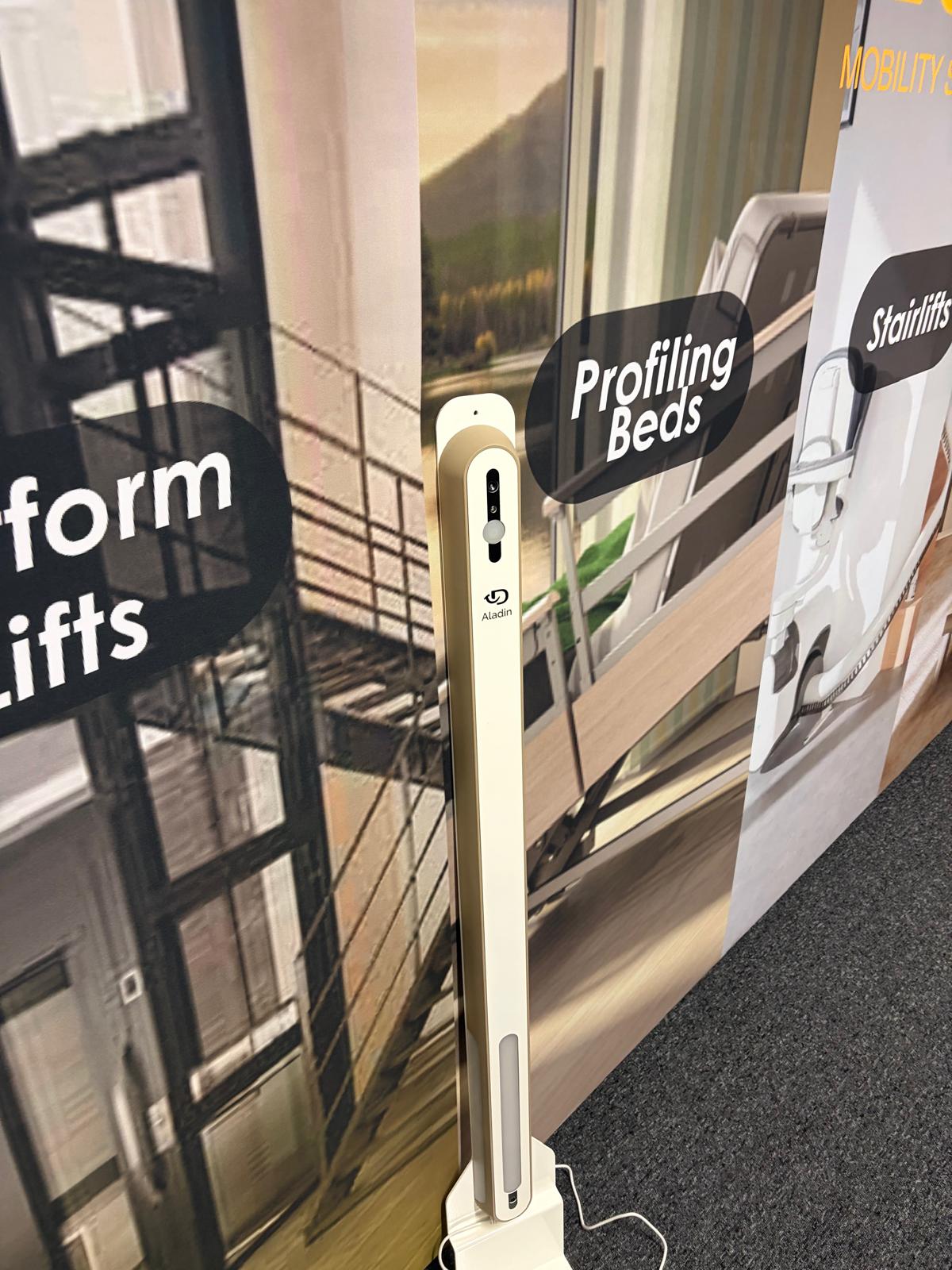 The E&M Mobility Specialists team with installation and care equipment branding