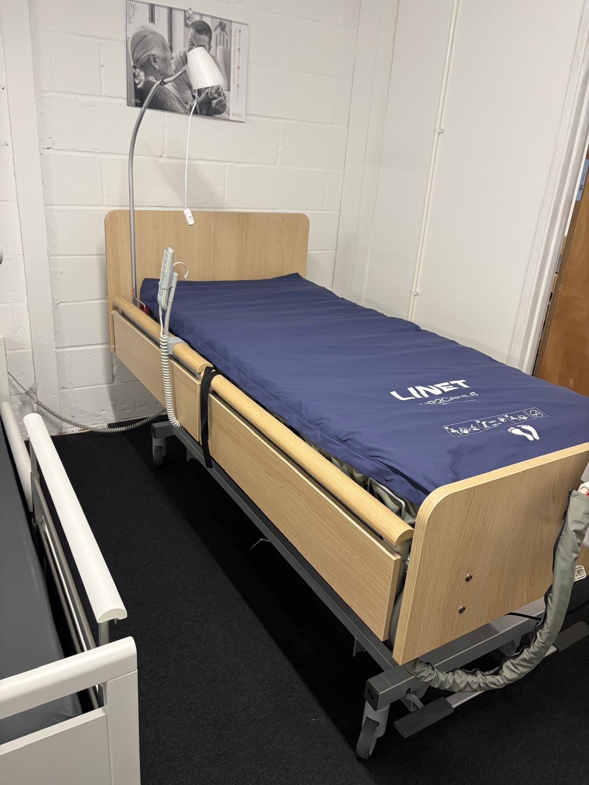 LINET AirCare pressure-relief mattress system on a profiling bed