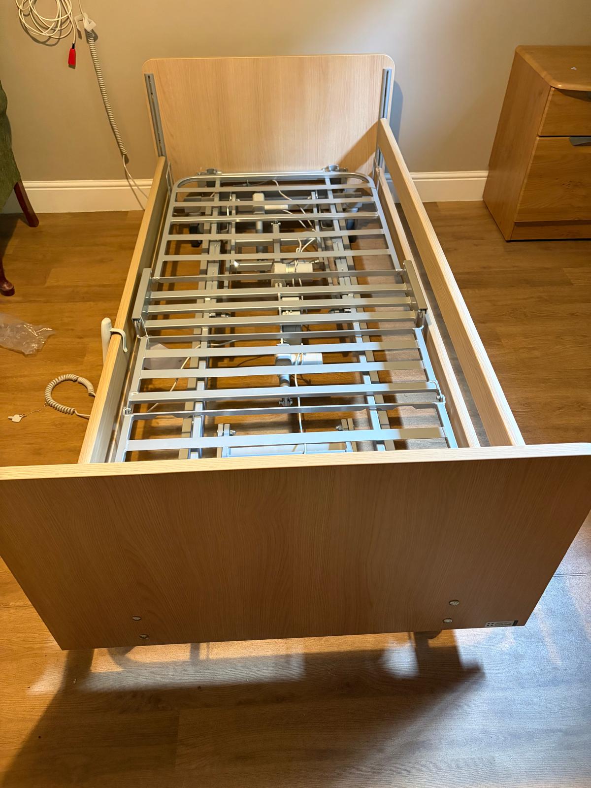 Profiling bed frame and mechanism exposed for routine maintenance